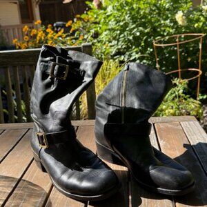 Black leather 'moto' boots with gold zipper and buckles.